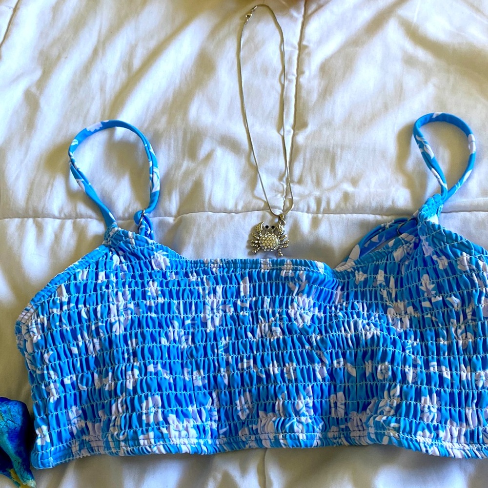 Blue swimsuit covered in flowers , comfy women’s swim suit top bikini